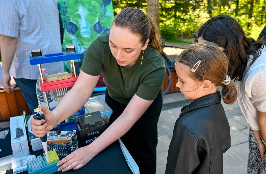 Young visitor trying a hands-on experiment