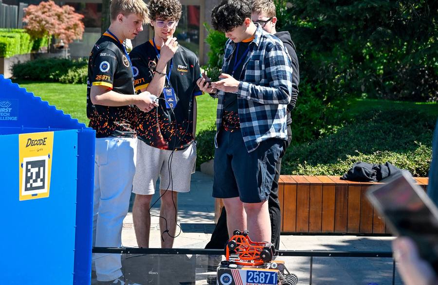Robotics team members preparing their robot