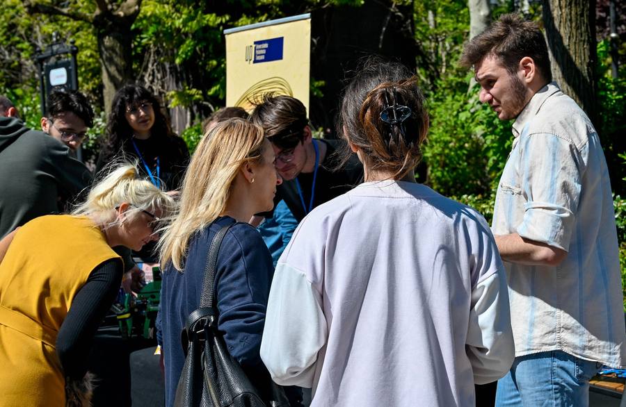 Visitors gathered around an exhibitor stand