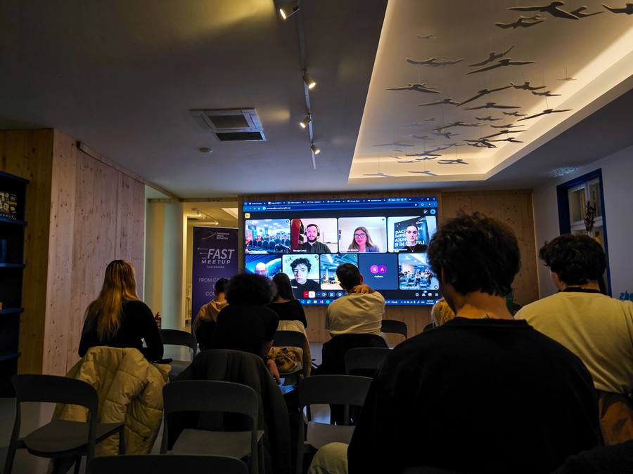 Online speakers on screen at FAST Meetup Timișoara 2025