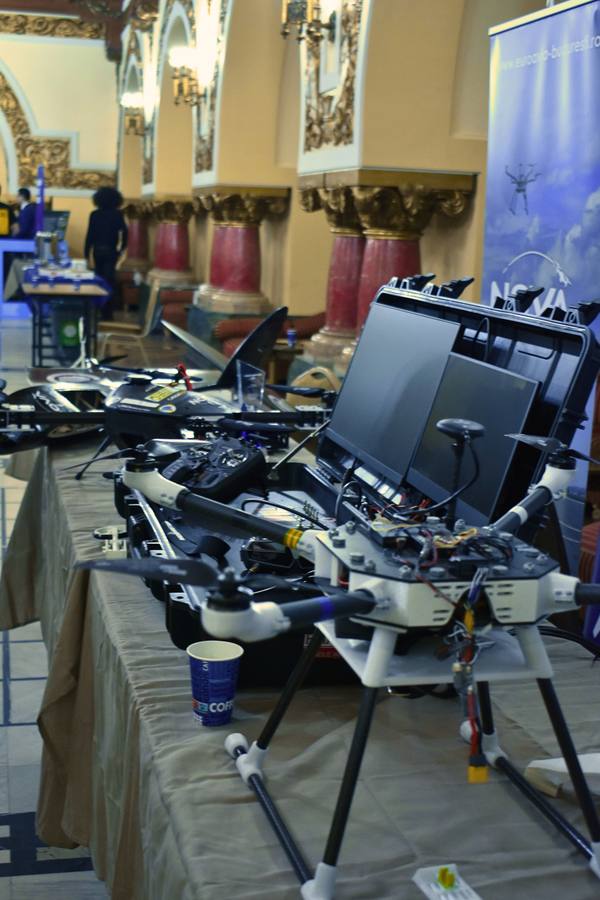 Drones and ground equipment on display at a partner stand